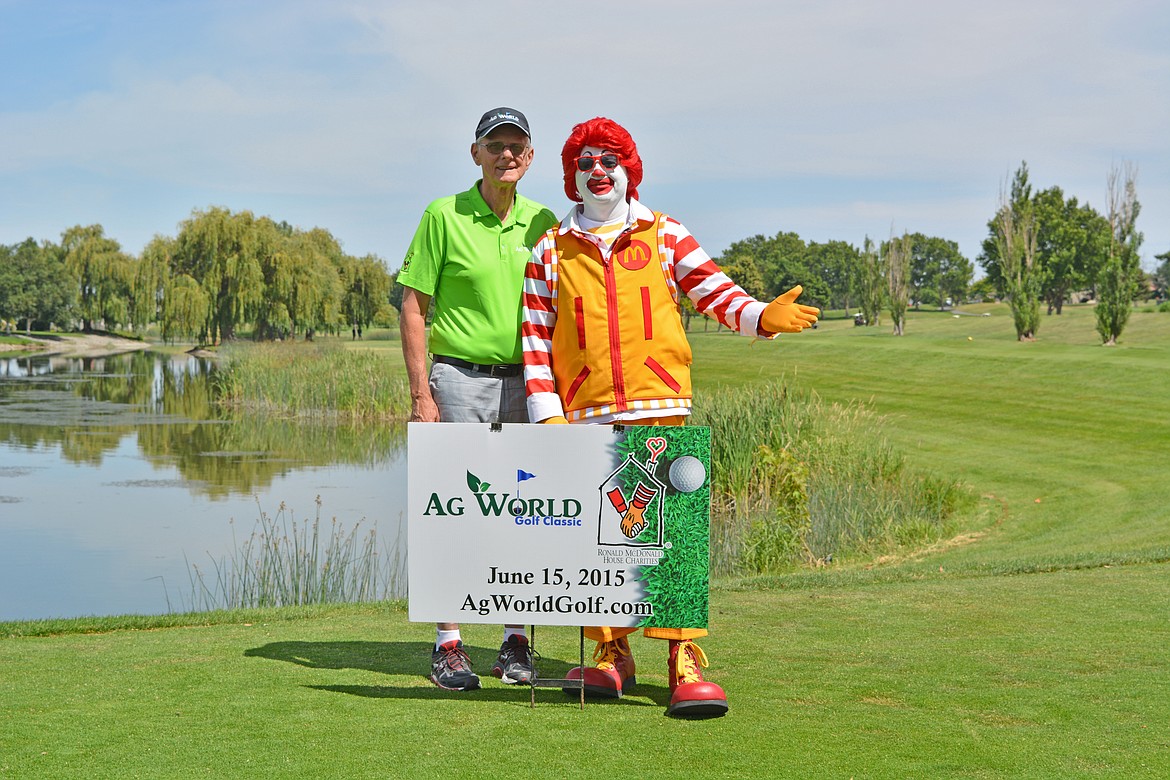 Warren Henninger and Ronald McDonald at 2015 Ag World Golf Classic, a fundraiser for the Ronald McDonald House of the Inland Northwest sponsored and organized by Ag World since 2013.