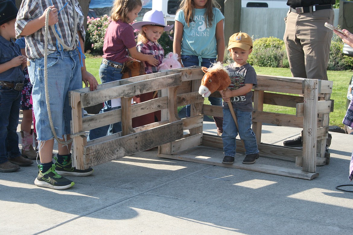 Sawyer Burress and his bronc come out of the gate during the bucking bronco contest at the Pee Wee Stampede, the children’s games at the Cowboy Breakfast.