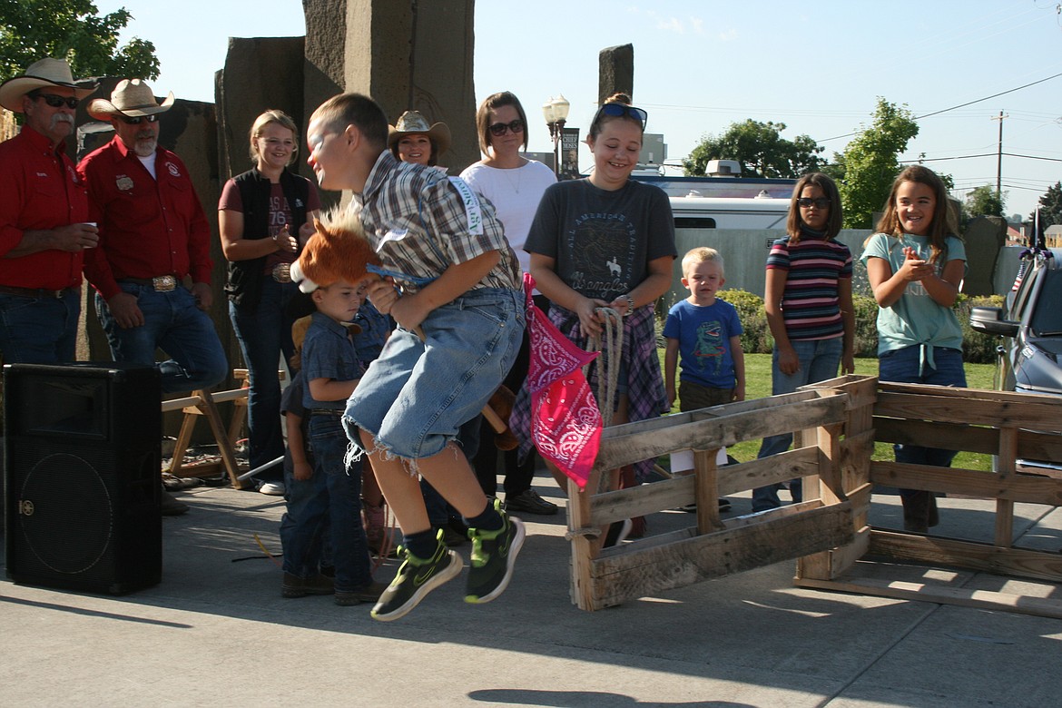 A rider waits to give the signal in the bucking bronco contest at the Pee Wee Stampede.