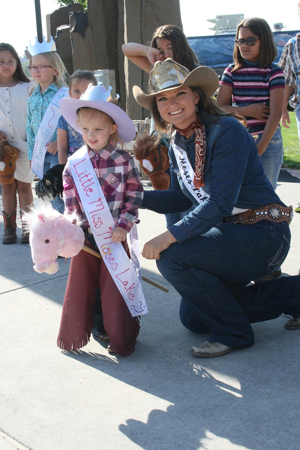 Harper Carey, queen of the Pee Wee Stampede, poses for a picture with Miss Moses Lake Roundup Brianna Kin Kade.