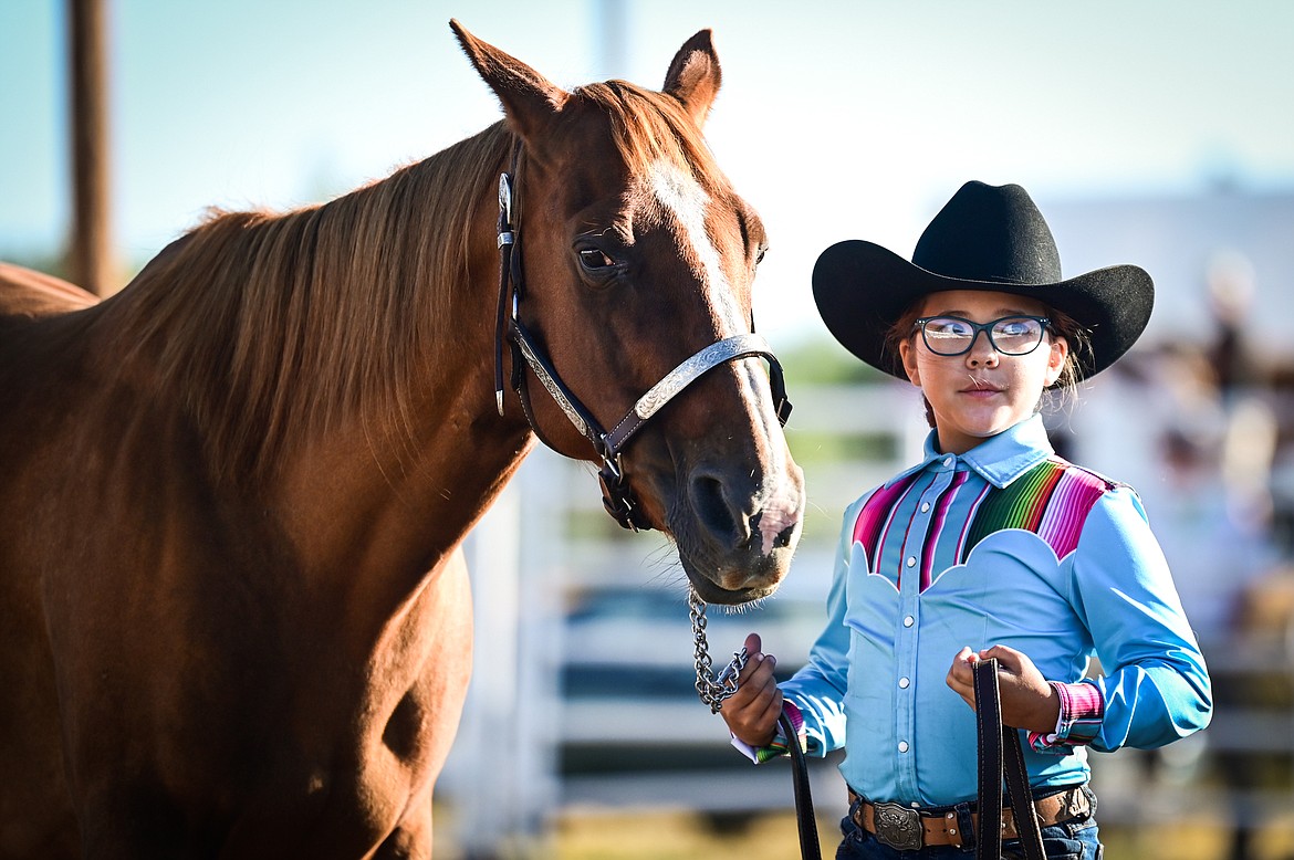 Emily Stolfus stands with her horse during novice level showmanship at the 4-H Horse Show at the Northwest Montana Fair on Saturday, Aug. 13. (Casey Kreider/Daily Inter Lake)