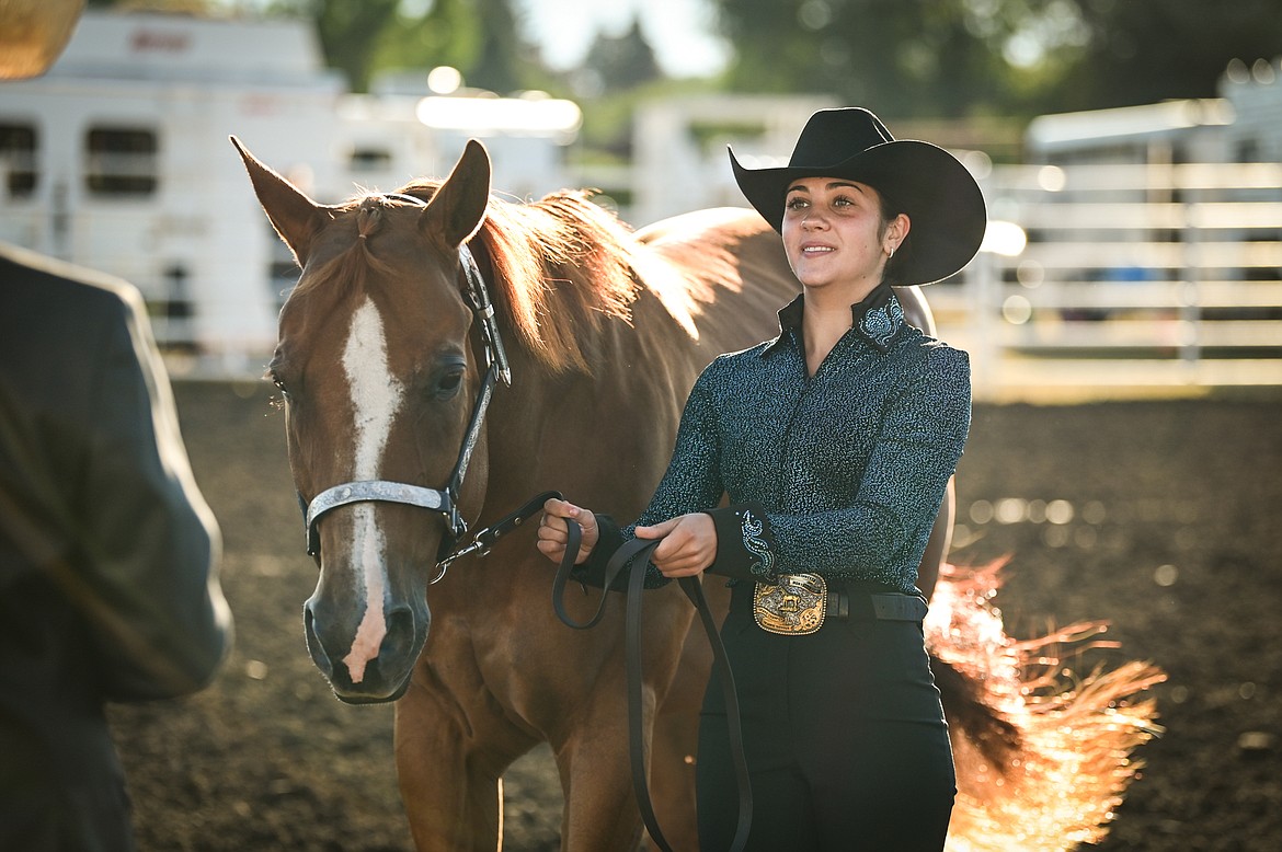 Anna Tretter leads her horse through the pattern during senior level showmanship at the 4-H Horse Show at the Northwest Montana Fair on Saturday, Aug. 13. Tretter won grand champion in her division. (Casey Kreider/Daily Inter Lake)