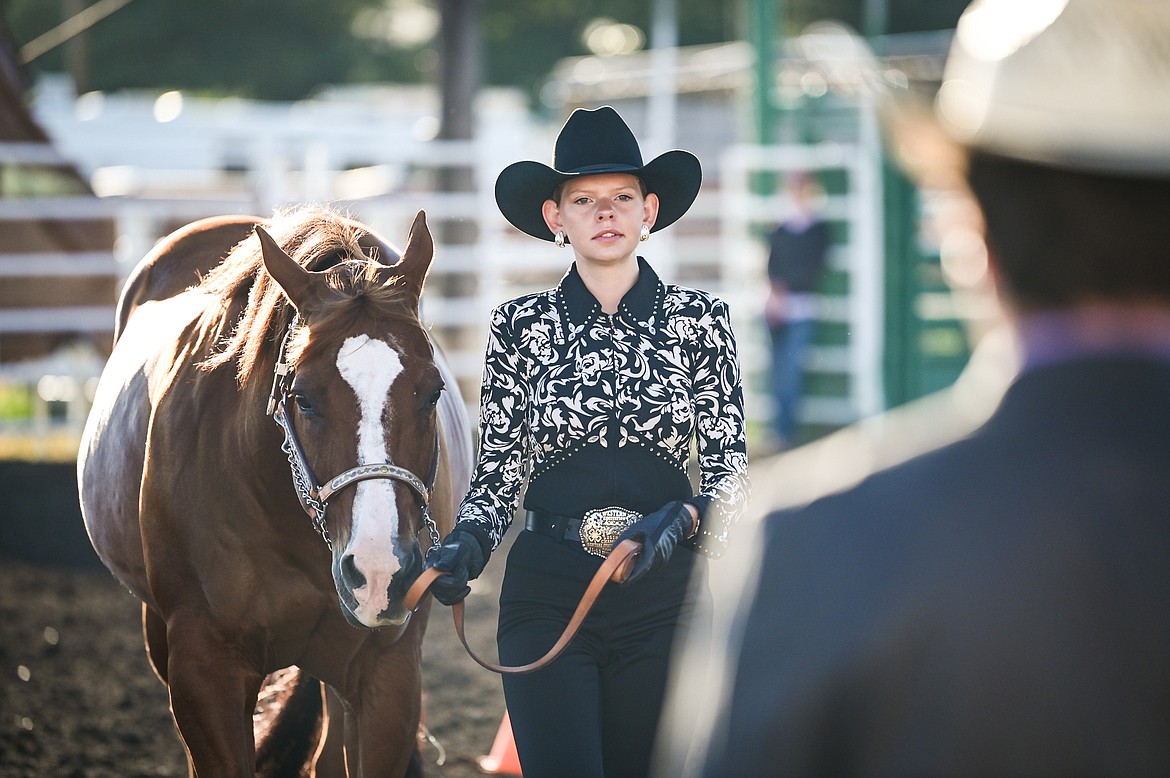 Quindy Gronley leads her horse through the pattern during senior level showmanship at the 4-H Horse Show at the Northwest Montana Fair on Saturday, Aug. 13. (Casey Kreider/Daily Inter Lake)
