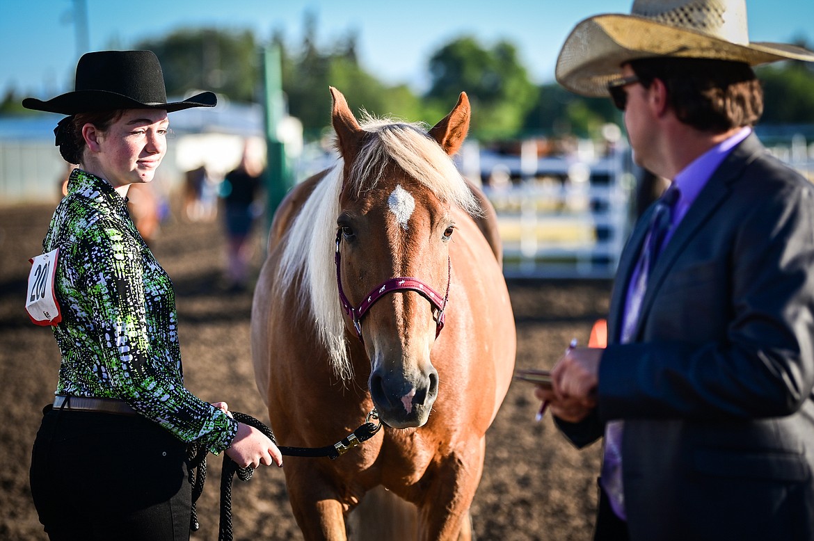 Abby Visnovske stands by her horse for judge Tyrell Burklund during junior level showmanship at the 4-H Horse Show at the Northwest Montana Fair on Saturday, Aug. 13. (Casey Kreider/Daily Inter Lake)
