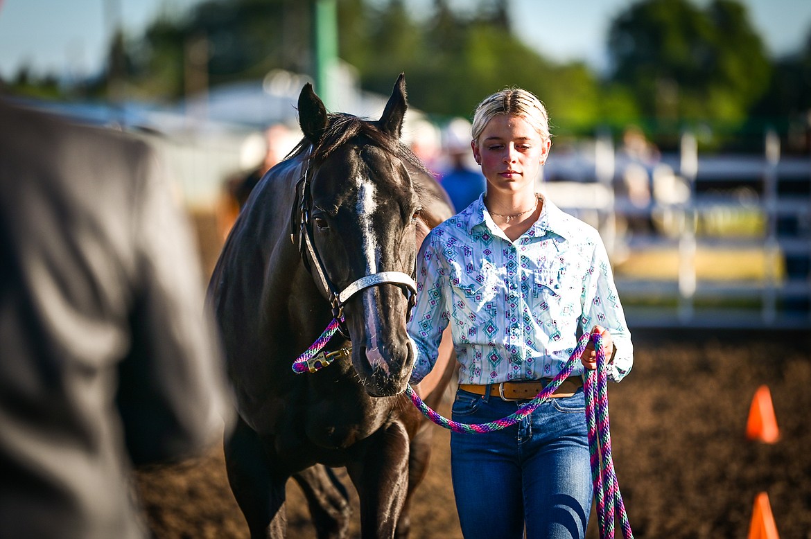 Caroline Owens leads her horse through the pattern during junior level showmanship at the 4-H Horse Show at the Northwest Montana Fair on Saturday, Aug. 13. (Casey Kreider/Daily Inter Lake)