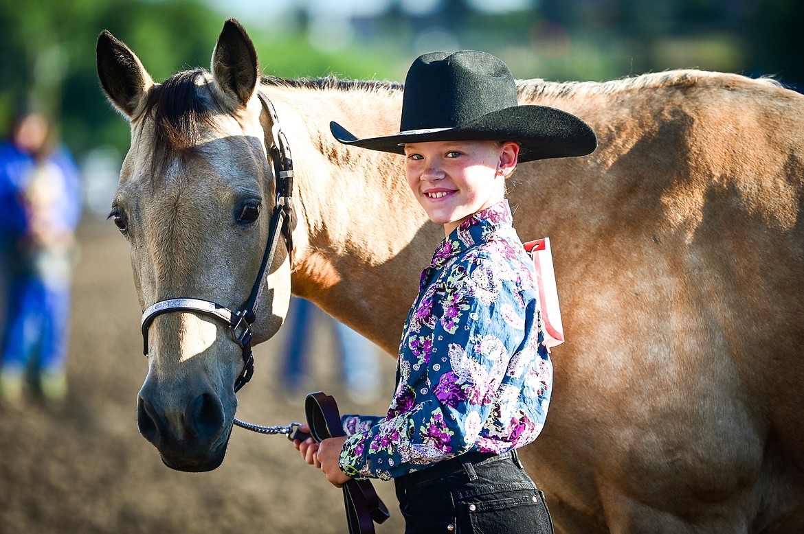 Kylie Boucher stands with her horse during novice level showmanship at the 4-H Horse Show at the Northwest Montana Fair on Saturday, Aug. 13. Boucher won grand champion in her division. (Casey Kreider/Daily Inter Lake)