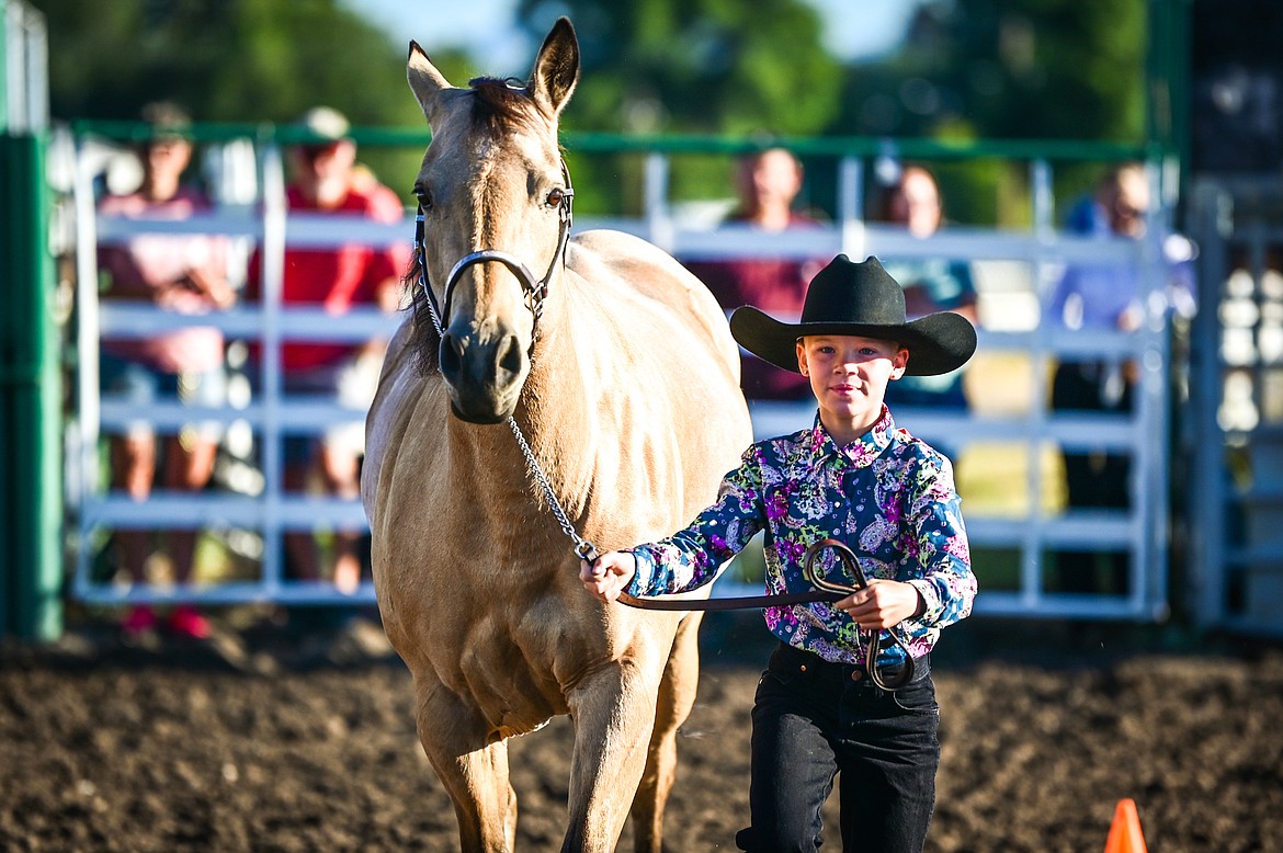 Kylie Boucher leads her horse through the pattern during novice level showmanship at the 4-H Horse Show at the Northwest Montana Fair on Saturday, Aug. 13. Boucher won grand champion in her division. (Casey Kreider/Daily Inter Lake)