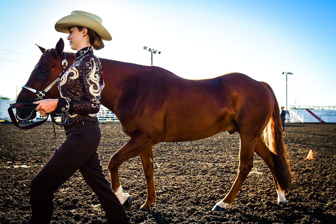 Kiley Ohs leads her horse during junior level showmanship at the 4-H Horse Show at the Northwest Montana Fair on Saturday, Aug. 13. (Casey Kreider/Daily Inter Lake)