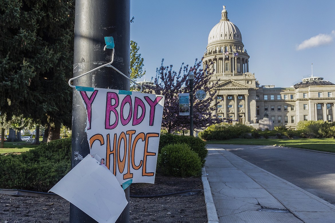 A sign reading "My body, my Choice," is taped to a hanger taped to a streetlight in front of the Idaho State Capitol Building on May 3, 2022. The Idaho Supreme Court ruled on Friday, Aug. 12, that the state's strict abortion bans will be allowed to take effect while legal challenges over the laws play out in court. (Sarah A. Miller/Idaho Statesman via AP, File)