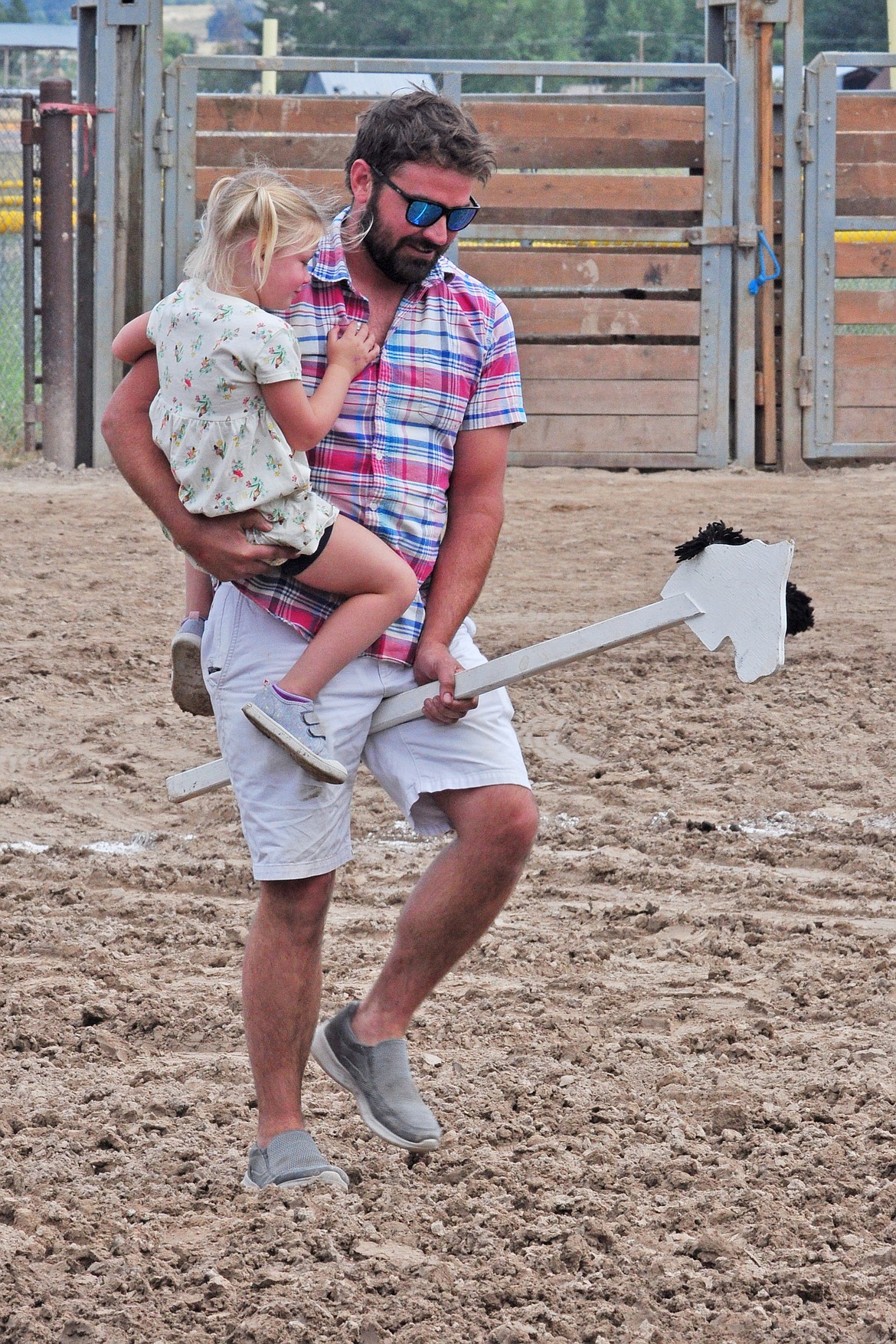 Dad assists his cutie in the stick Horse Race in the Kiddie Slicker Rodeo at the Lake County Fair. (Marla Hall/Lake County Leadre)