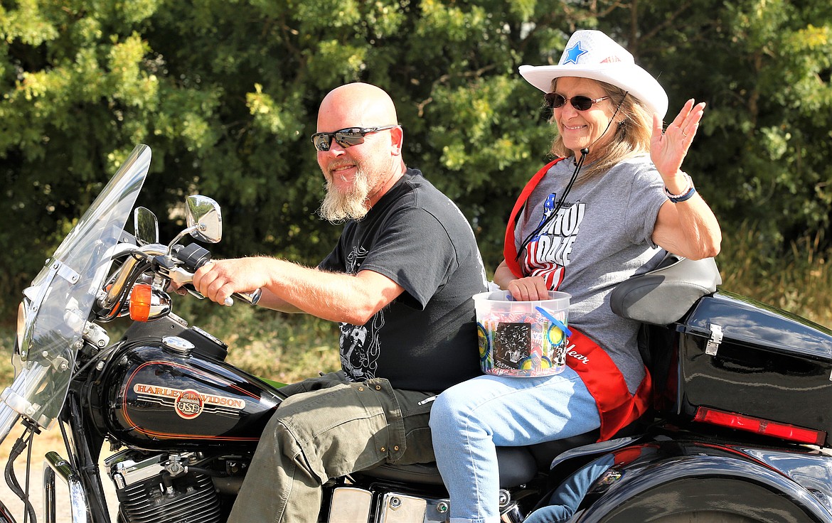 Athol’s Citizens of the Year Gary and Cindi Devine ride a Harley-Davidson in the Athol Daze Parade.