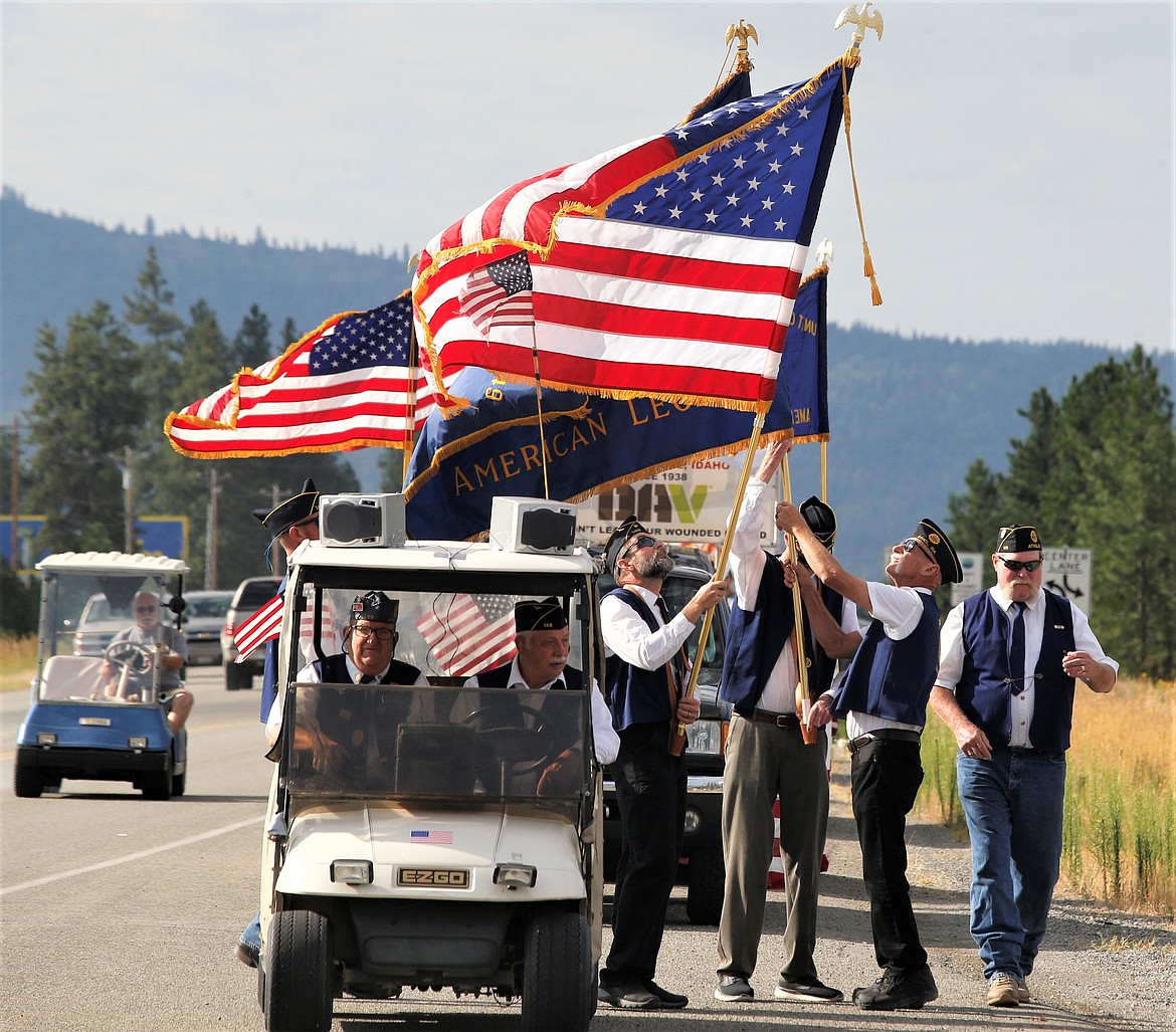 Veterans prepare to carry the flags before the Athol Daze Parade on Saturday.
