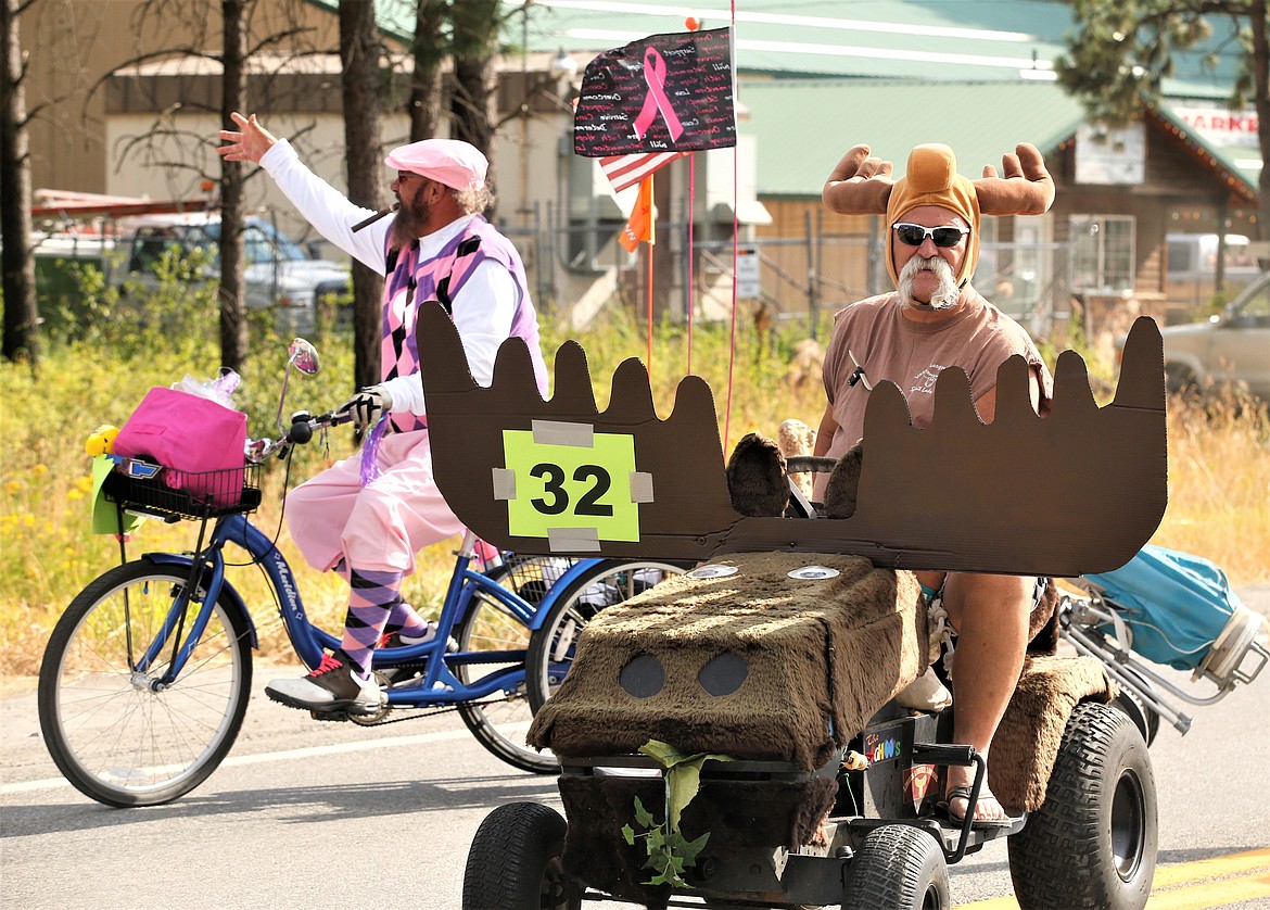 George "Hollywood" Zick, with horns, and Marty Radenz take part in the Athol Daze Parade.