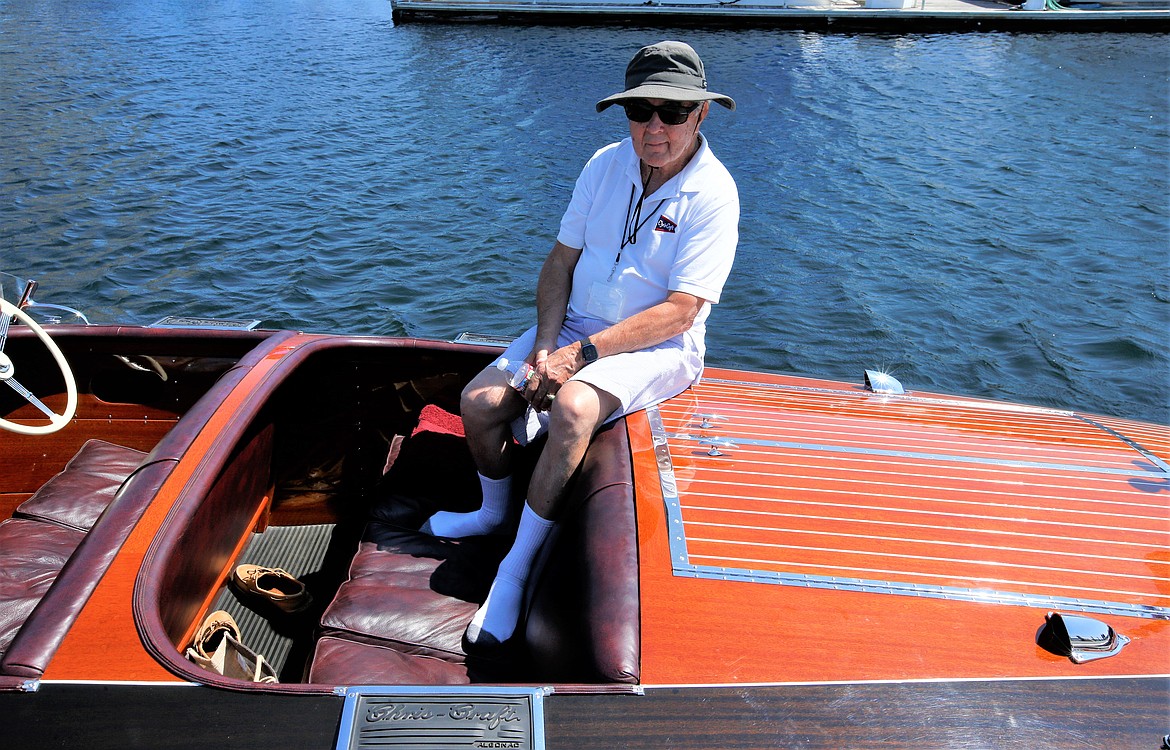 Don Vogt of Hayden Lakes sits in his 1938 Chris-Craft at the Coeur d’Alene Antique & Classic Boat Festival at the boardwalk on Saturday.