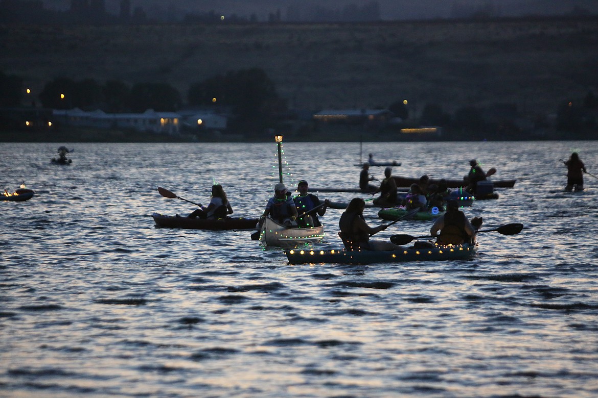 The vessels on the lake were decorated with glow sticks and other glow-in-the-dark items to illuminate the lake during the Moonlight Paddle.