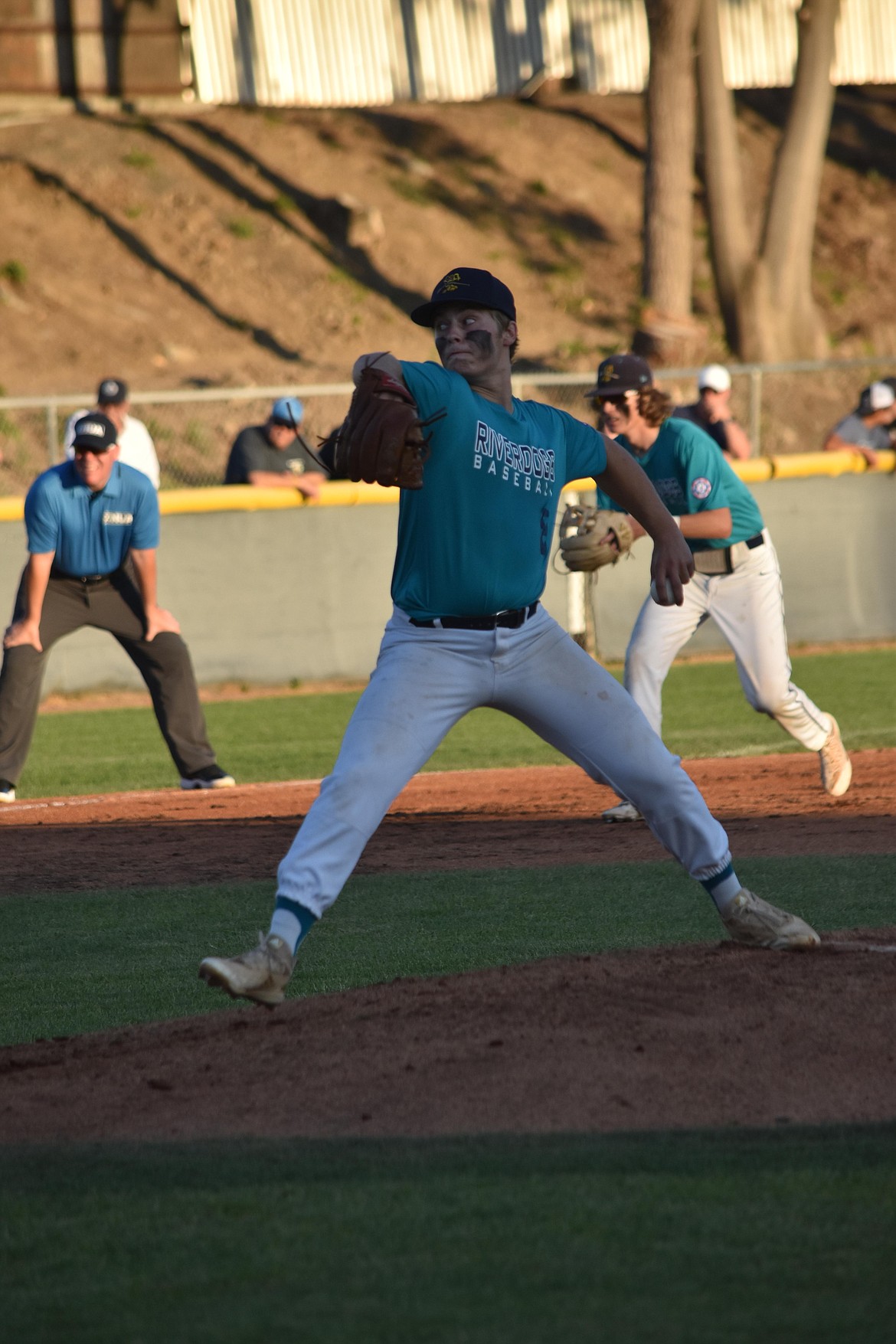 Pitcher Ethan Black unleashes a pitch in the Riverdogs’ 7-5 win over Farmers Baseball on Wednesday.