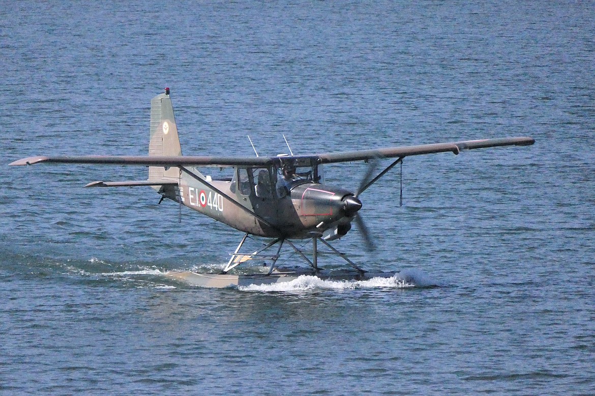 An Italian "scout" seaplane taxis toward the docking area at the Lodge and Resort at Lake Mary Ronan during a seaplane fly-in Saturday morning.  (Chuck Bandel/VP/MI)