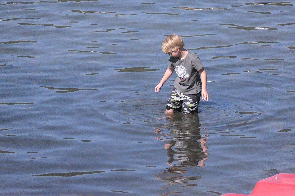 A youth follows in the footsteps of every young man before him, and goes in search of the unknown, somewhere beneath the surface of Lake Mary Ronan. If you find out what he was after, let us know! (Chuck Bandel/VP-MI photo)