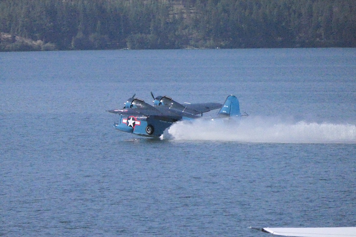 A Grumman Widgeon, used by several branches of the US Armed Forces during World War II, touches down on Lake Mary Ronan during Saturday's seaplane fly-in at the Lodge and Resort.