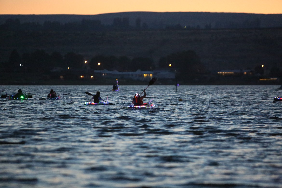 Attendees decorated their vessels with glow-in-the-dark objects to illuminate themselves on the water.