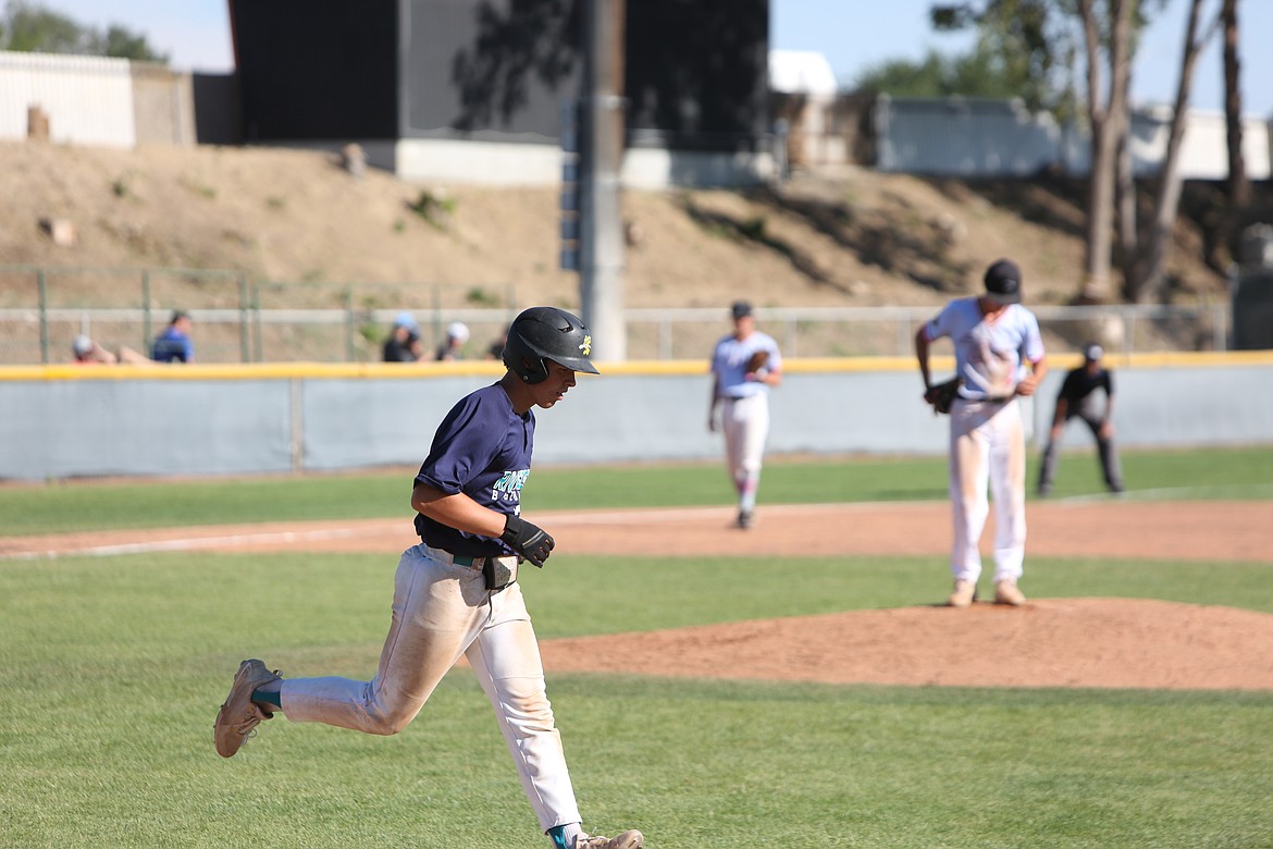 Ethan Gustafson heads to first base in the Riverdogs’ loss to the Southeast Tropics on August 11, 2022.