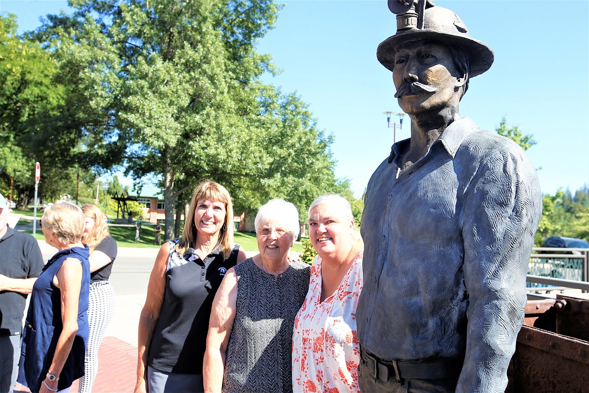 Tiia Brown is joined by daughters Lisa Callahan, left, and Laura Taylor following the dedication of "The Miner" on Monday.