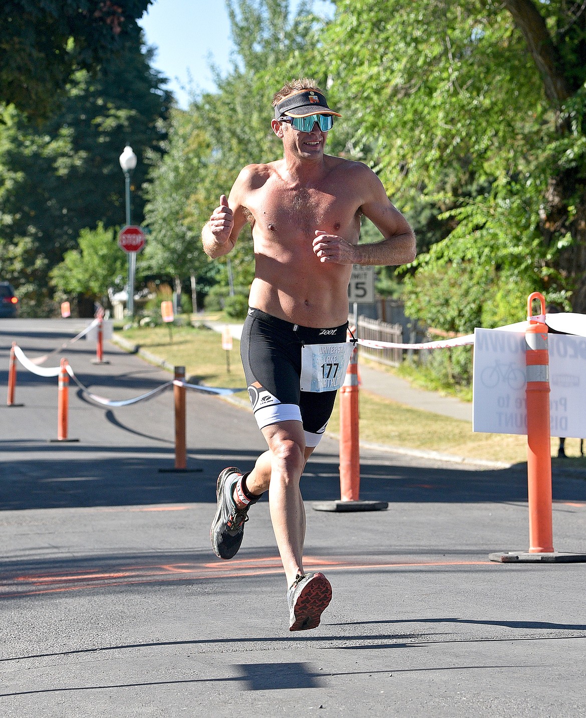 Jeff Brown of Whitefish runs to a second-place finish at the Whitefish Lake Triathlon on Sunday, Aug. 14. (Whitney England/Whitefish Pilot)