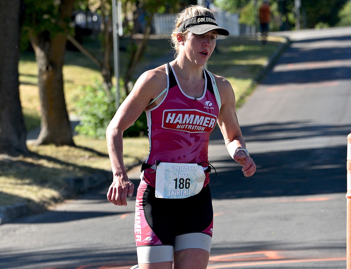 Scarlet Kaplan of Whitefish runs to a third-place overall finish, first in the women's category, at the Whitefish Lake Triathlon on Sunday, Aug. 14. (Whitney England/Whitefish Pilot)