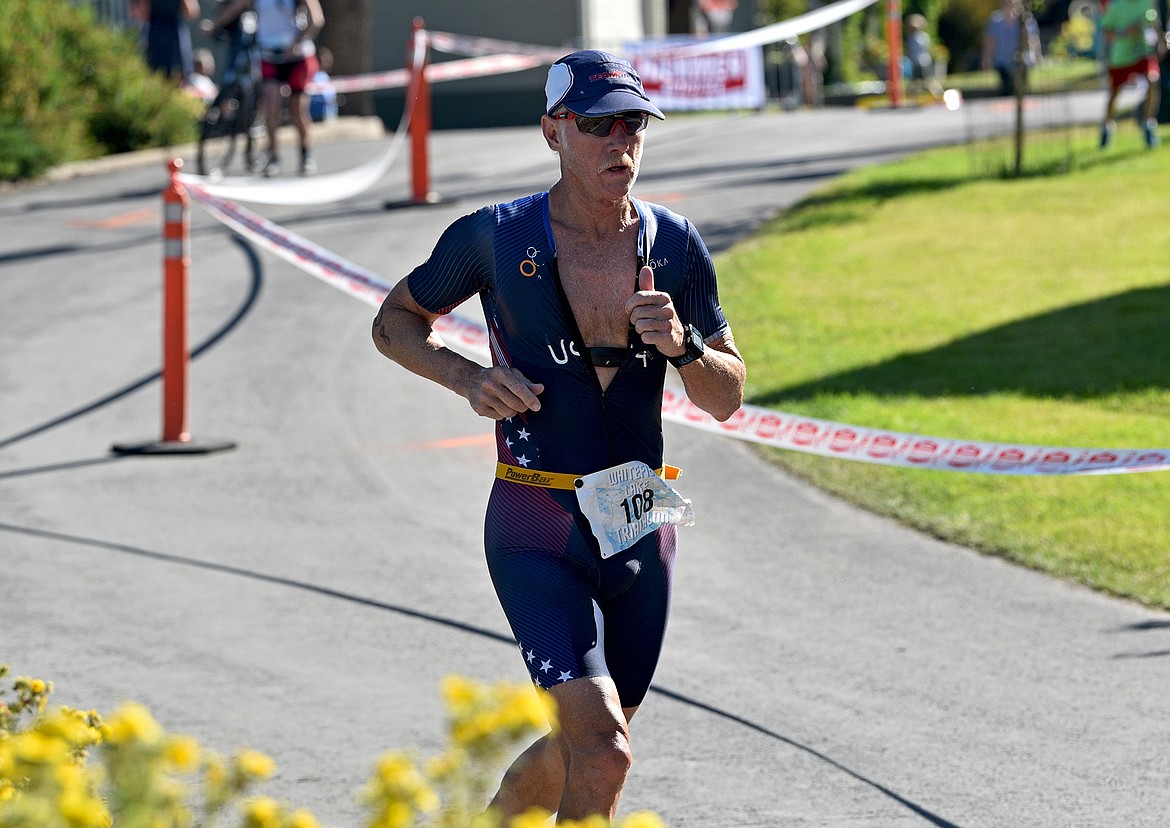 Steven Wade runs in the Whitefish Lake Triathlon on Sunday, Aug. 14. (Whitney England/Whitefish Pilot)