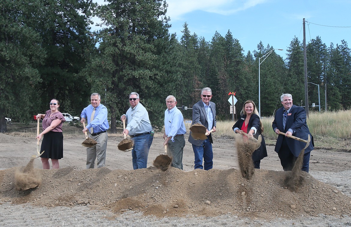 Gov. Brad Little assists Idaho Transportation Department leaders and board members as they break ground Tuesday afternoon at the Highway 41 and Interstate 90 interchange project site in Post Falls. From left: Amy Schroeder, ITD Transportation Expansion Congestion Mitigation program manager; Scott Stokes, ITD director; Bill Moad, Idaho Transportation Board chairman; Jim Thompson, Idaho Transportation District 1 board member; Little; Julie DeLorenzo, District 3 board member; and Dan McElhinney, ITD chief operations officer.