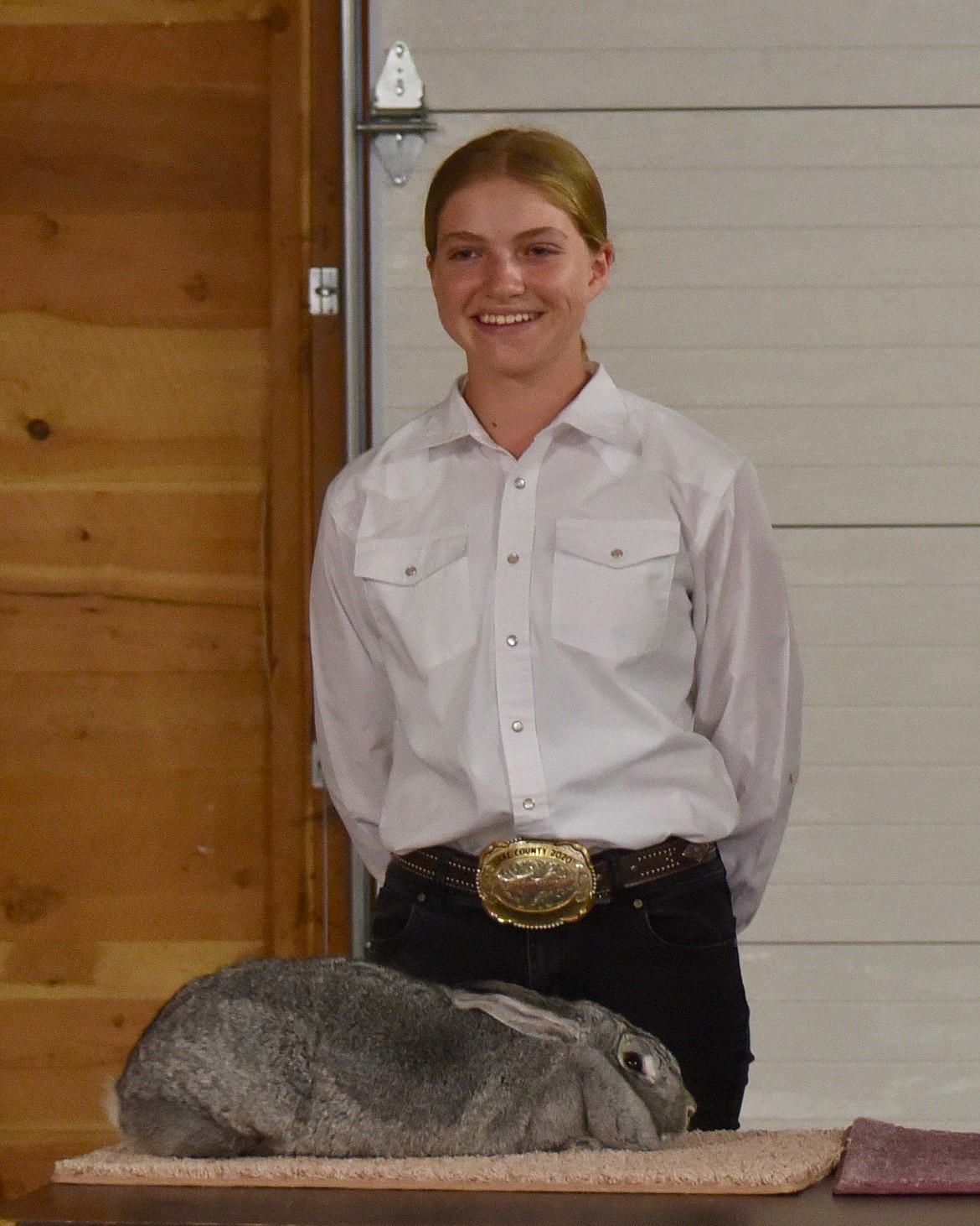 Lina Sturman showed several different animals — both large and small on her way to winning  Sr. Reserve Grand Champion large animal showman, Sr Grand Champion Small Animal Showman, and Overall Small Animal Showman. (Marla Hall/Lake County Leader)