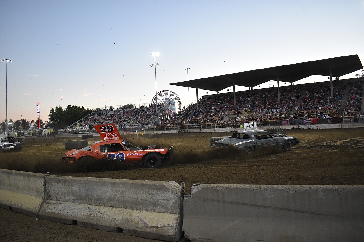 Flying dirt, smoke, engines revving and cheering filled the air as heat by heat cars took to the track.