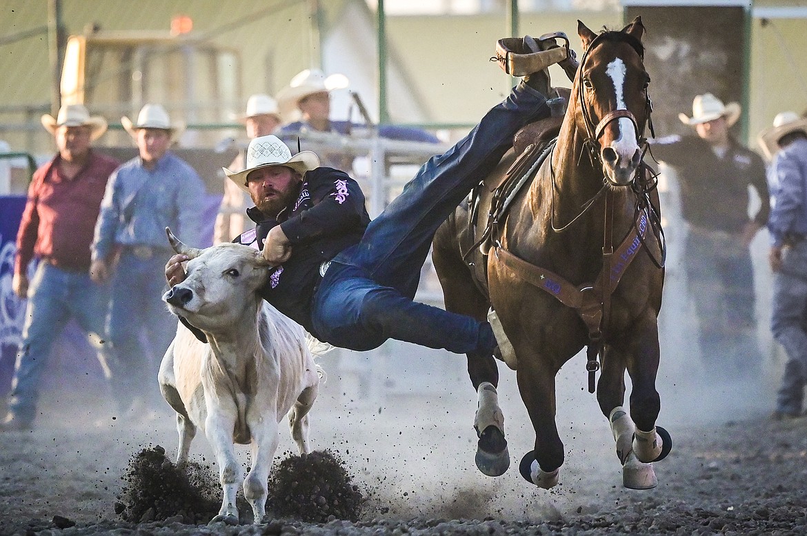 Clayton Hass, from Weatherford, Texas, competes in steer wrestling at the Northwest Montana Fair & Rodeo on Thursday, Aug. 18. (Casey Kreider/Daily Inter Lake)