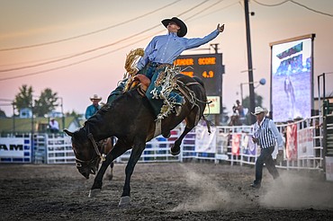 Kole Ashbacher, from Arrowwood, Alberta, Canada, competes in saddle bronc riding at the Northwest Montana Fair & Rodeo on Thursday, Aug. 18. (Casey Kreider/Daily Inter Lake)
