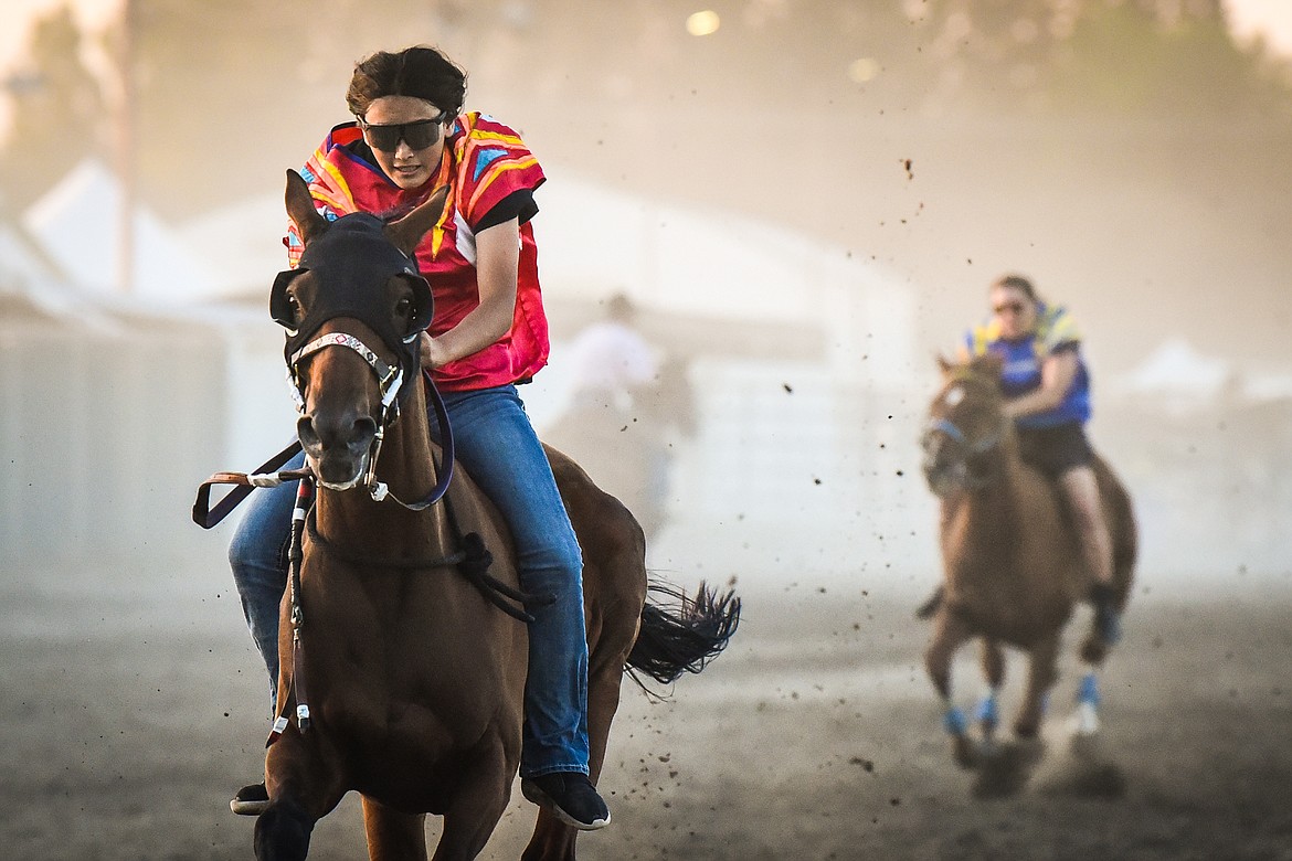Riders compete in the women's Indian Relay Races at the Northwest Montana Fair & Rodeo on Thursday, Aug. 18. (Casey Kreider/Daily Inter Lake)