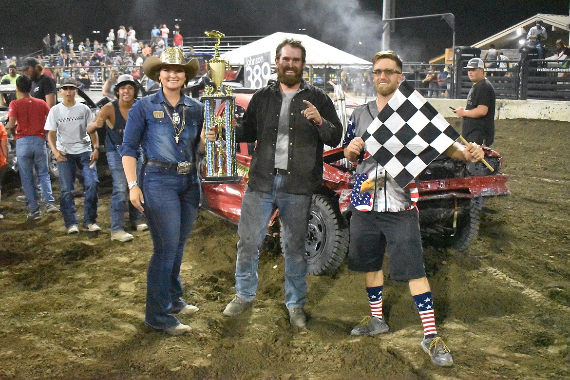 CJ Johnson, center, won the 80’s Demo. He posed with Miss Moses Lake Roundup Brianna Kin Kade, left, and Brandon Douglass, right, when he received his trophy.