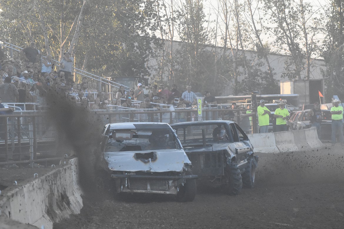 Dirt sprayed the crowd as cars rounded corners on the track and grazed the barrier.