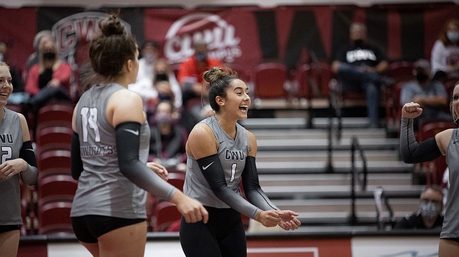 Setter/outside hitter Tia Andaya celebrates with her during a match. The GNAC Newcomer of the Year finished with 10 kills and 17 assists in CWU’s exhibition match.