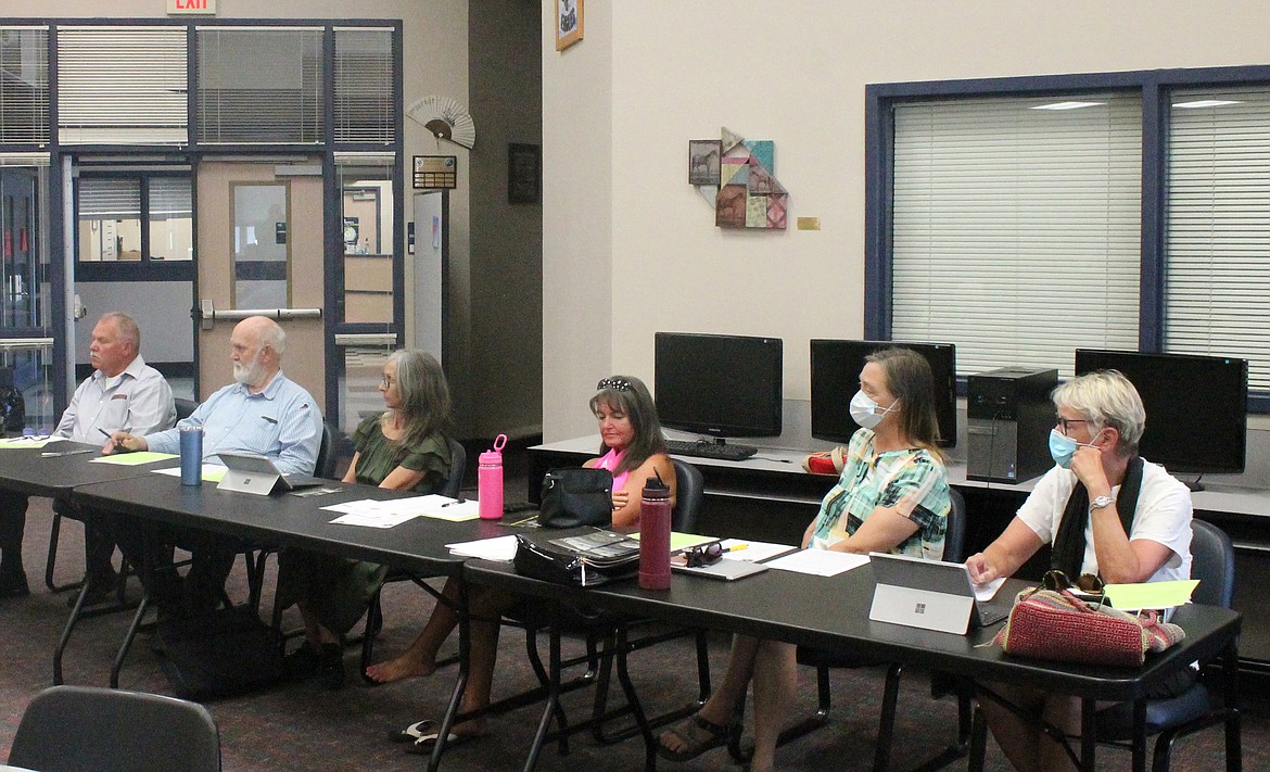 From left: Soap Lake City Council members Allen DuPuy, Bill Bratton, Karen Woodhouse, Kat Sanderson, Leslie Taylor and Kayleen Bryson listen to Mayor Michelle Agliano read a letter from Kayla Isaacson of the Soap Lake Prevention Coalition at Wednesday’s council meeting.