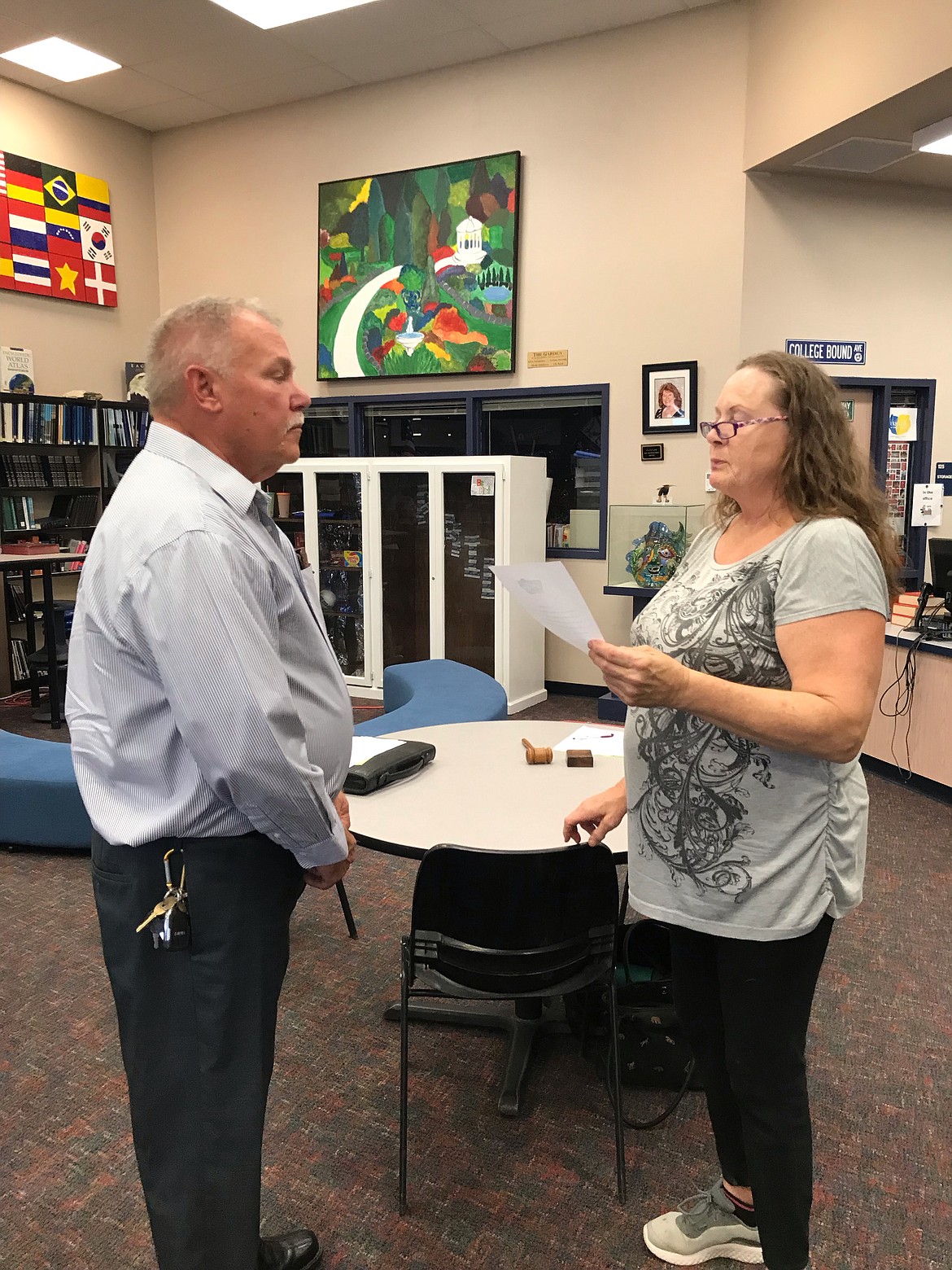 Soap Lake Mayor Michelle Agliano swears in Allen DuPuy as the town’s newest city council member Wednesday.