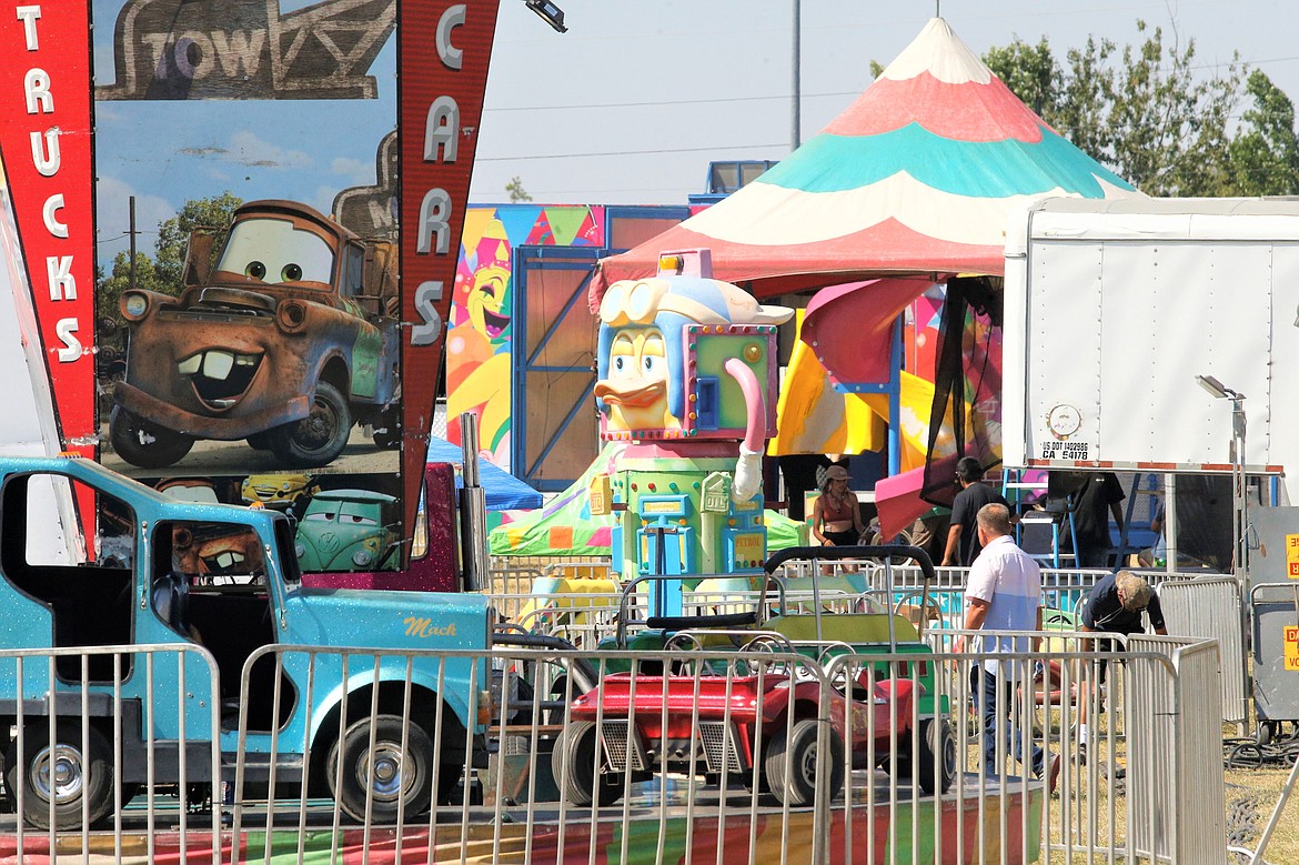 Crews set up the rides for the North Idaho State Fair on Thursday.