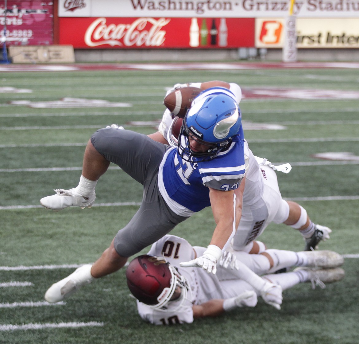 JASON ELLIOTT/Press
Coeur d'Alene junior running back Carsen Speelman battles for a few extra yards during the second quarter of Friday's game against Rigby at Washington-Grizzly Stadium in Missoula, Mont.