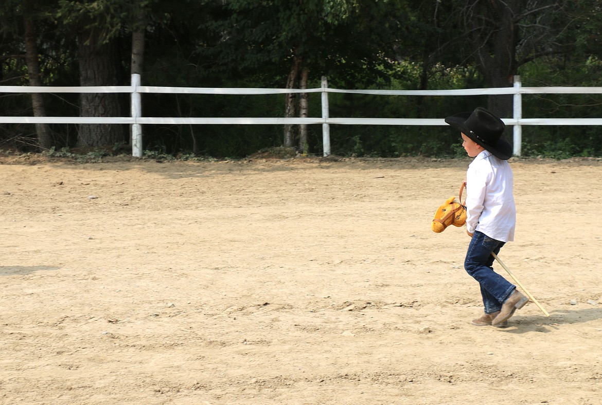 Oliver Ruen races around the practice arena as he takes part in the World's Smallest Rodeo on Friday.