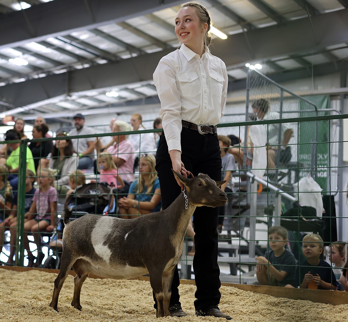 Kalispell's Brynn Mason keeps eye contact with the judge during goat judging at the Northwest Montana Fair Aug. 18. (Jeremy Weber/Daily Inter Lake)