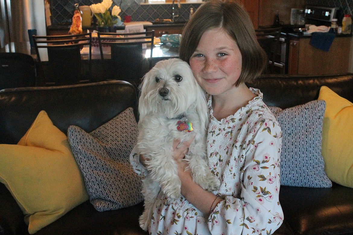 Kristi Jenks, 10, holds her furry friend Silver at their Royal City home.