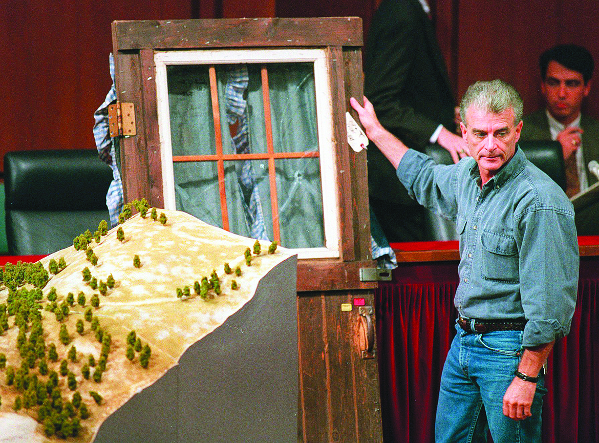 Randy Weaver holds the door of his cabin showing holes from bullets fired during the 1992 siege of his Ruby Ridge, Idaho, home, model at left, during testimony before the Senate Judiciary Subcommittee on Capitol Hill in Washington on Sept. 6, 1995. Weaver had died at the age of 74. The Ruby Ridge standoff left three people dead and served as a spark for the growth of anti-government extremists.