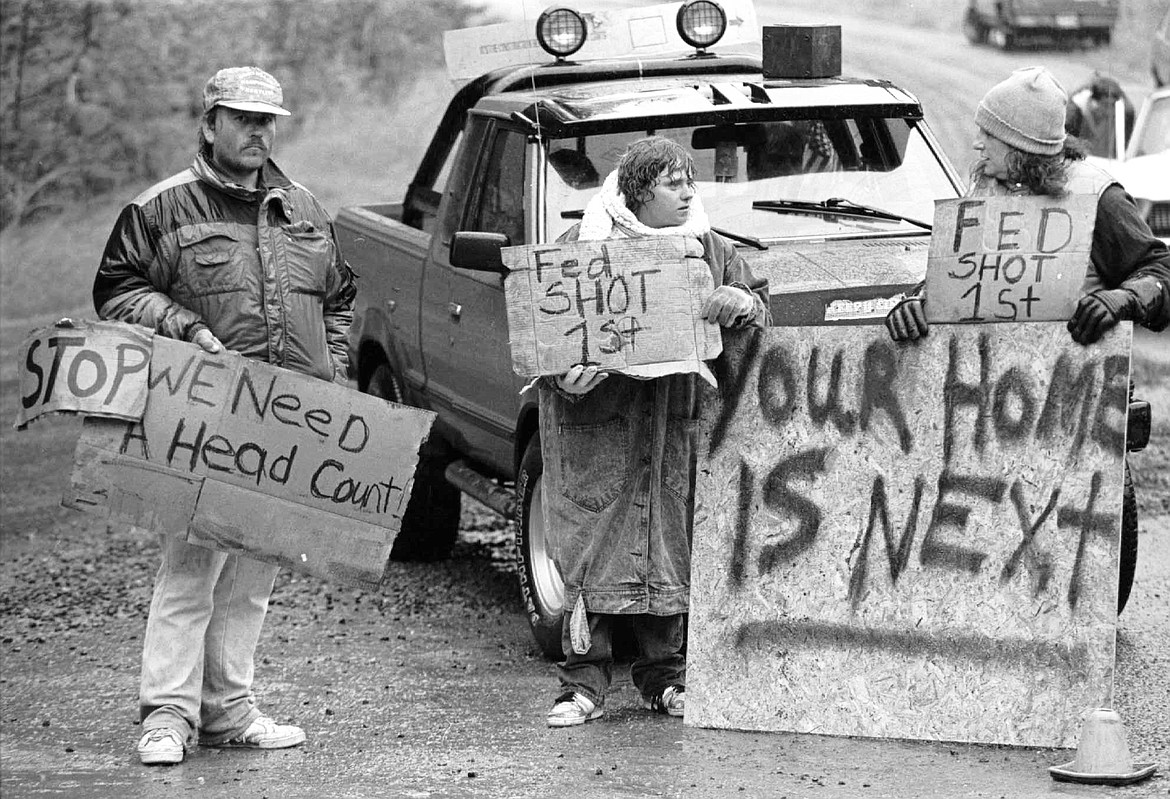 This Aug. 23, 1992, file photo shows Randy Weaver supporters at Ruby Ridge in northern Idaho. It's been a quarter century since a standoff in the remote mountains of northern Idaho left a 14-year-old boy, his mother and a federal agent dead and sparked the expansion of radical right-wing groups across the country that continues to this day.