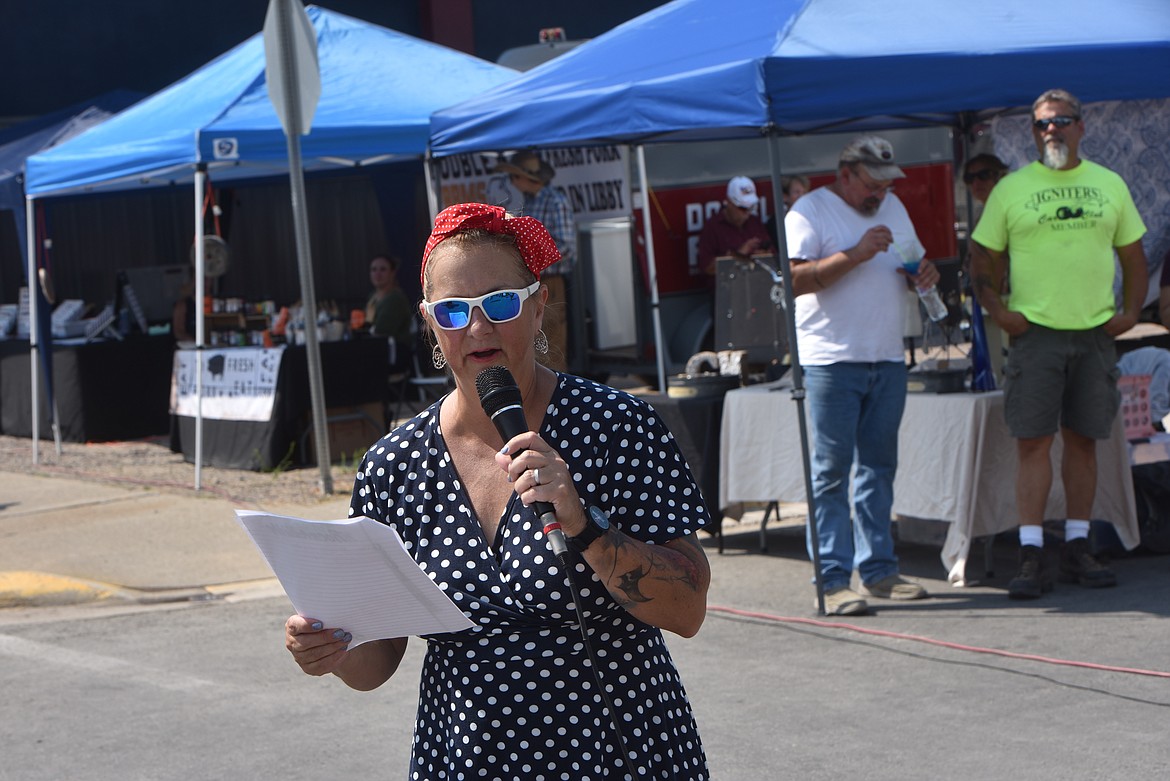 Igniters Car Club show organizer Dee Teske had no trouble staying busy on Saturday, Aug. 20, 2022, at the Ignite the Nite event in Libby. (Scott Shindledecker/The Western News)