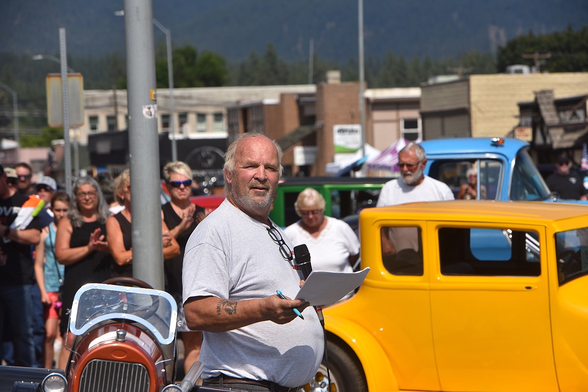 Igniters Car Club's Gary Rantala announced the winners in several contests at the Ignite the Nite Car show Saturday, Aug. 20, 2022, in Libby. (Scott Shindledecker/The Western News)