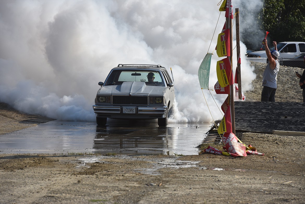 The smoke flew at the Igniters Car Club burn-out contest Saturday, Aug. 20, 2022, at the Millpond Motocross Park in Libby. (Scott Shindledecker/The Western News)